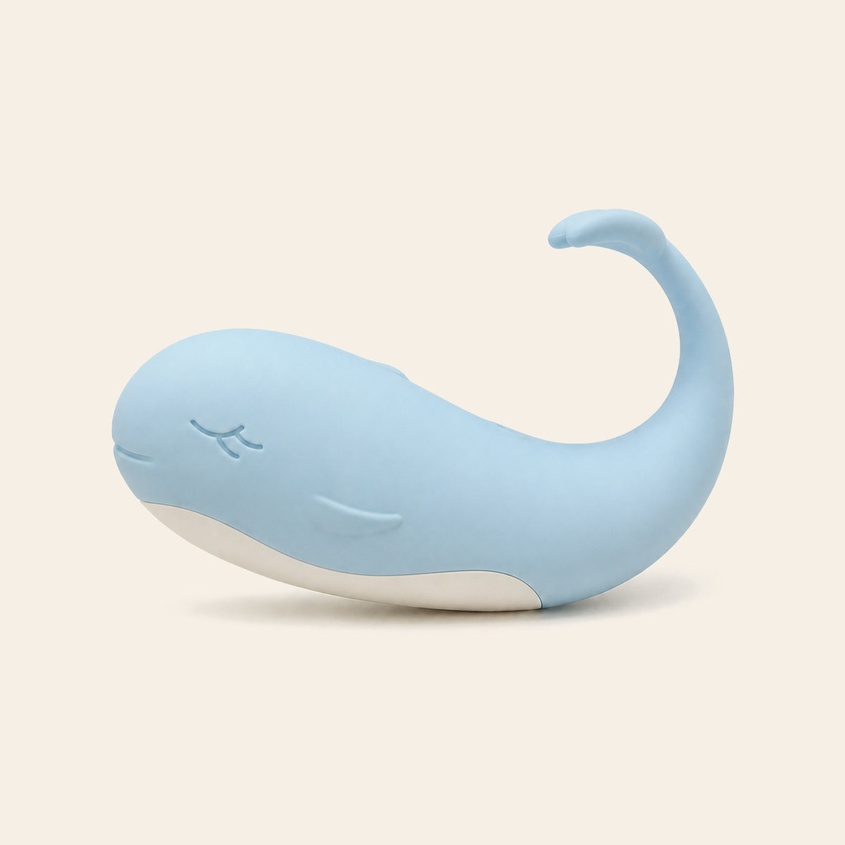 Pale blue whale-shaped silicone wearable vibrating egg on a soft beige background — Femme Bliss TidalBliss