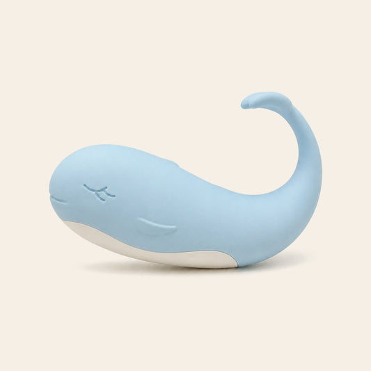 Pale blue whale-shaped silicone wearable vibrating egg on a soft beige background — Femme Bliss TidalBliss