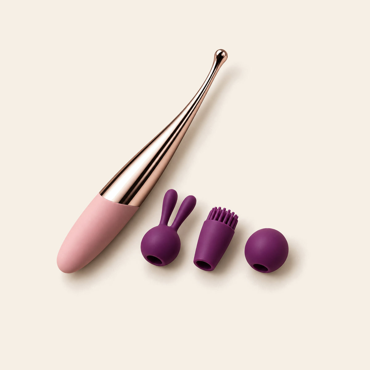 Pink curved G-spot wand with a rose-gold tip beside three purple slip-on silicone tip covers: rabbit-ear, soft bristle and round ball — Femme Bliss Bliss Curve Wand Plus Edition