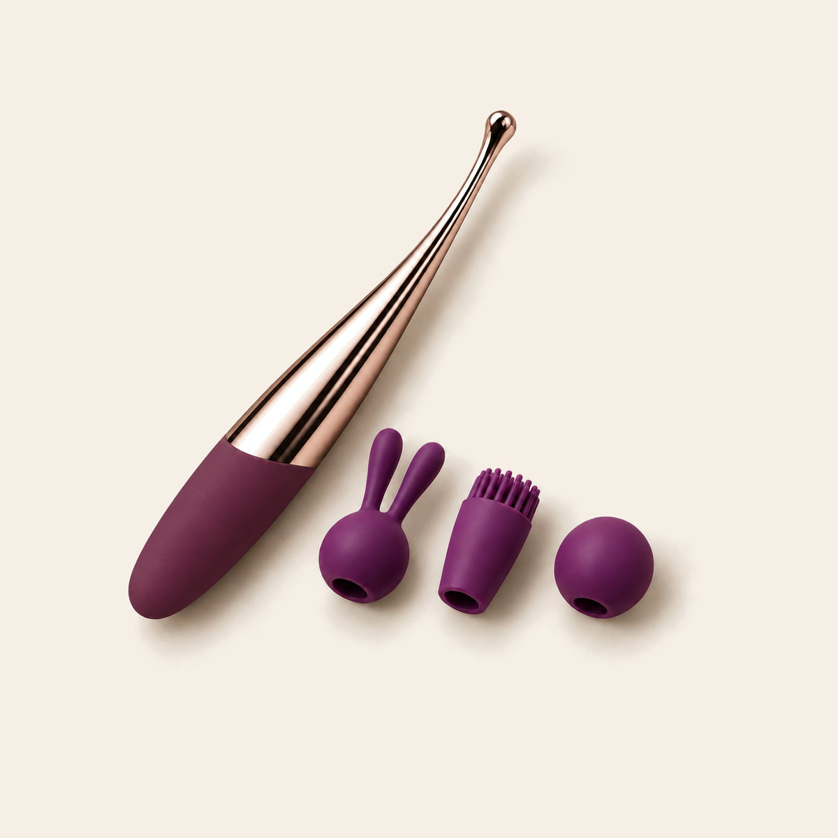 Deep purple curved G-spot wand with a rose-gold tip beside three purple slip-on silicone tip covers: rabbit-ear, soft bristle and round ball — Femme Bliss Bliss Curve Wand Plus Edition