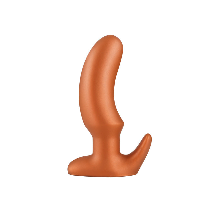 Gold tapered silicone butt plug, size L for advanced users, on a white background
