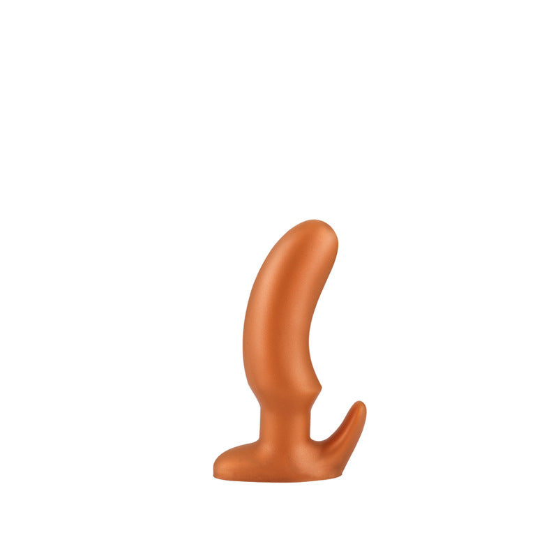 Gold tapered silicone butt plug, size S for beginners, on a white background