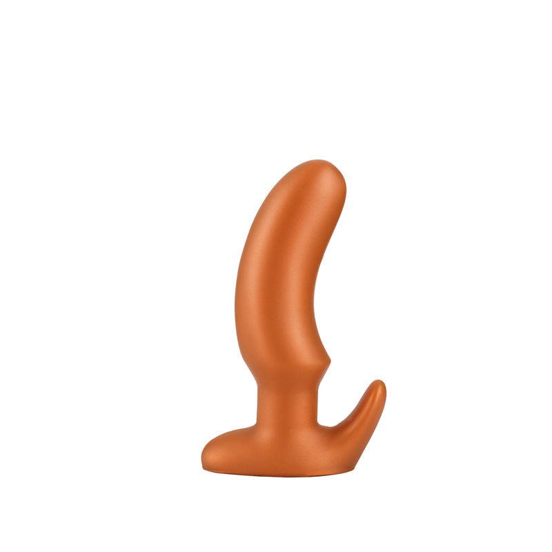 Gold tapered silicone butt plug, size M for intermediate users, on a white background
