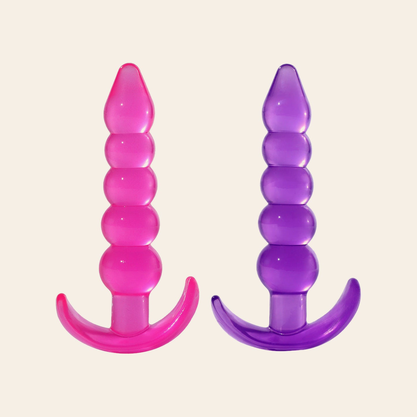 Silicone anal beads butt plug with five graduated beads and a curved T-base, shown in translucent pink and purple, on a beige background