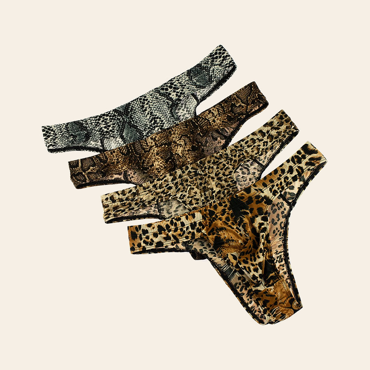 Three pairs of men's animal print briefs in snake, leopard and tiger patterns, laid flat on a soft beige background