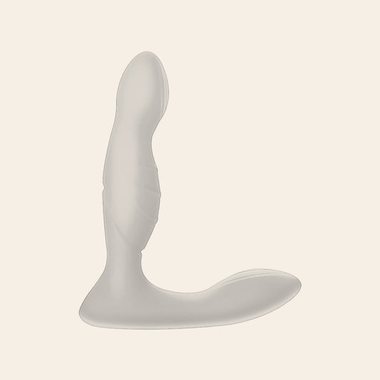 ApexPulse prostate massager in white — curved silicone shaft with a long flared perineum base, on a soft beige background