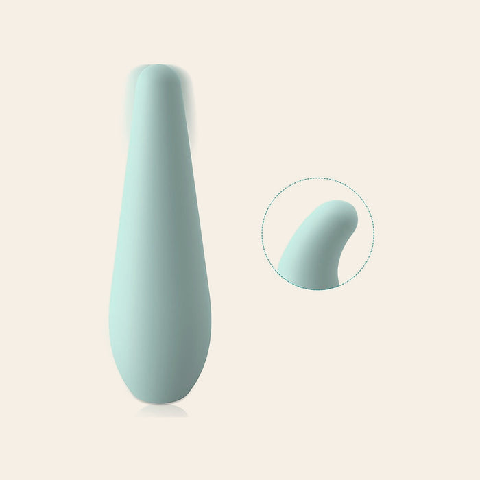 Mint teardrop-shaped silicone vibrator with a soft curved tip, on a soft beige background — Femme Bliss Aqua Whisper