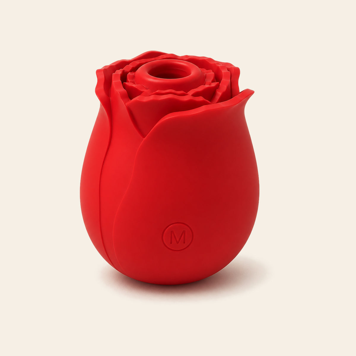 Red rose-shaped silicone clitoral suction vibrator on a soft beige background — Femme Bliss BloomPulse Rose