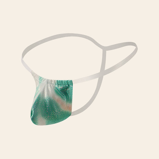 Men's open-back faux leather thong with a U-shaped contour pouch in an iridescent finish, on a soft beige background