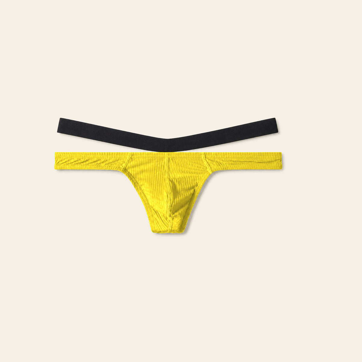 Men's low-rise thong in yellow with a contoured pouch and slim black waistband on a soft beige background — Femme Bliss Low-Rise Thong