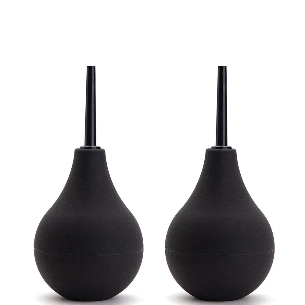 Two black silicone squeeze-bulb anal douches with slim nozzle tips