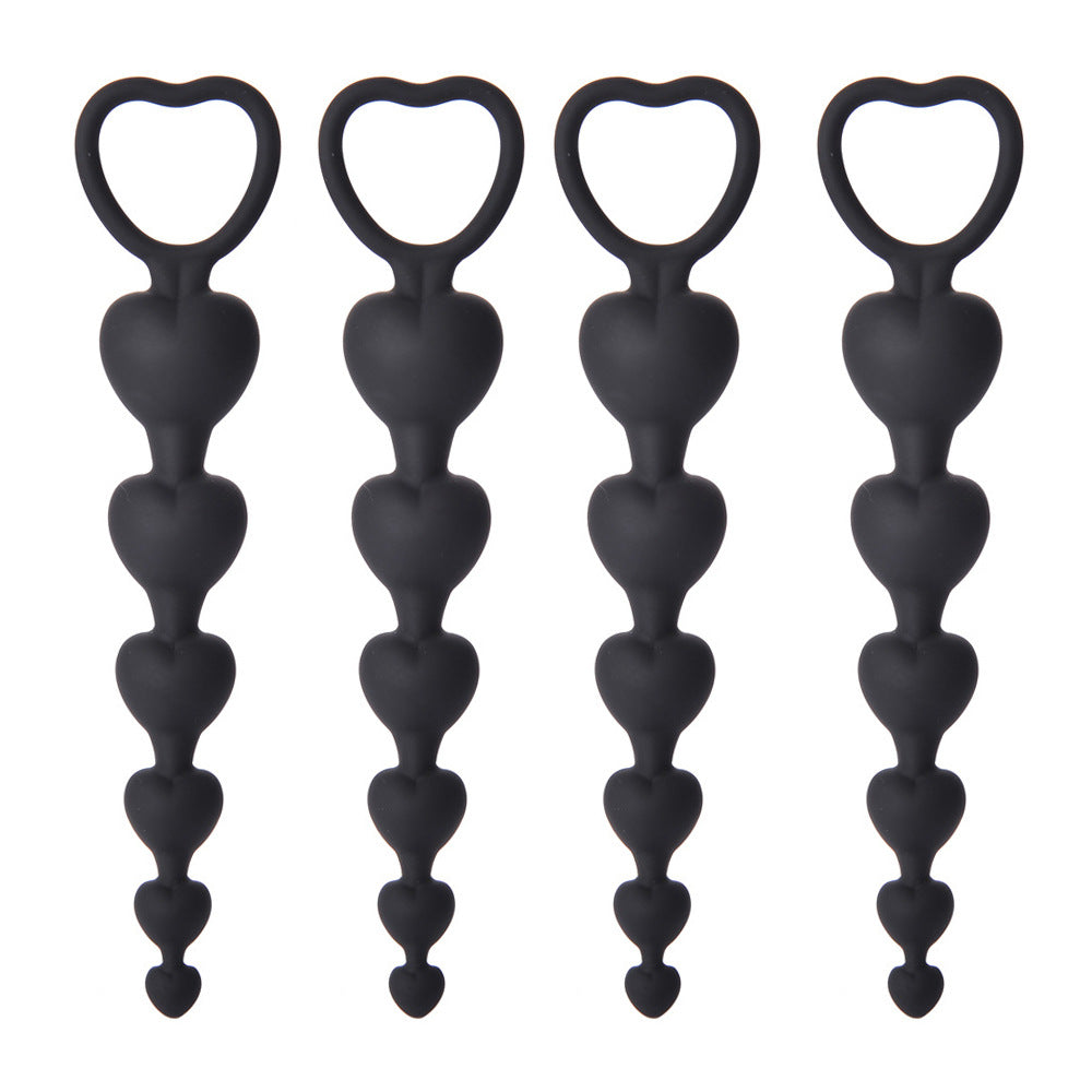Four black silicone anal bead strings with graduated beads and a heart-shaped pull ring