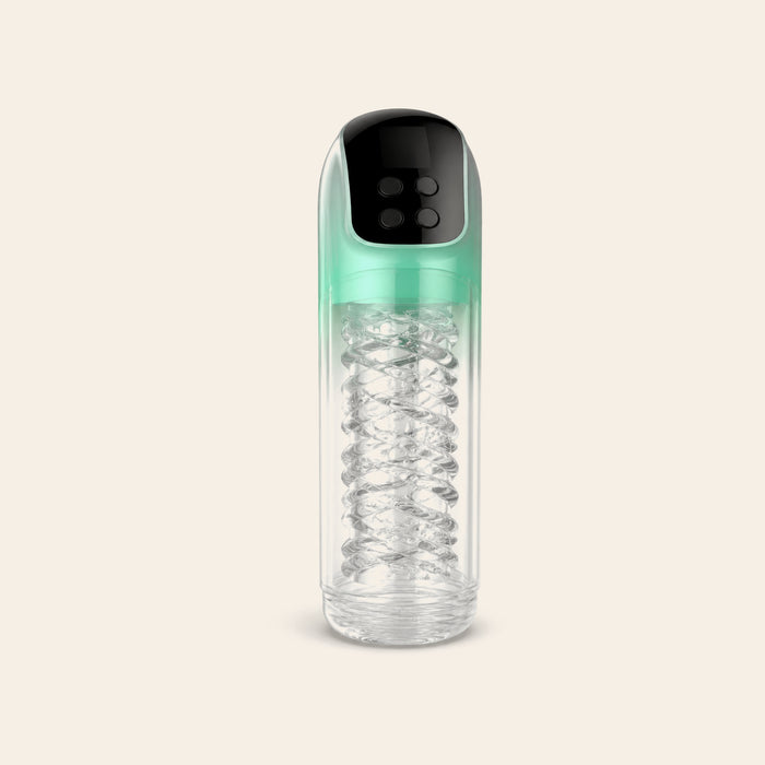 Automatic male masturbator with clear ribbed chamber, mint-green shell and digital control panel on a soft beige background — Femme Bliss PulseForge X