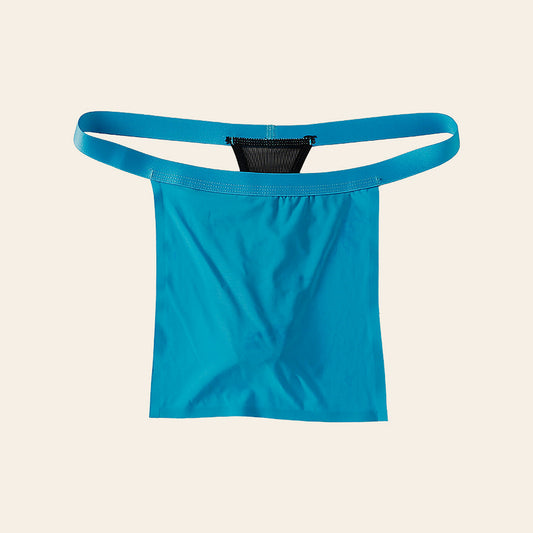 Men's low-rise sheer mesh thong in blue ice silk with a contoured pouch, on a soft beige background
