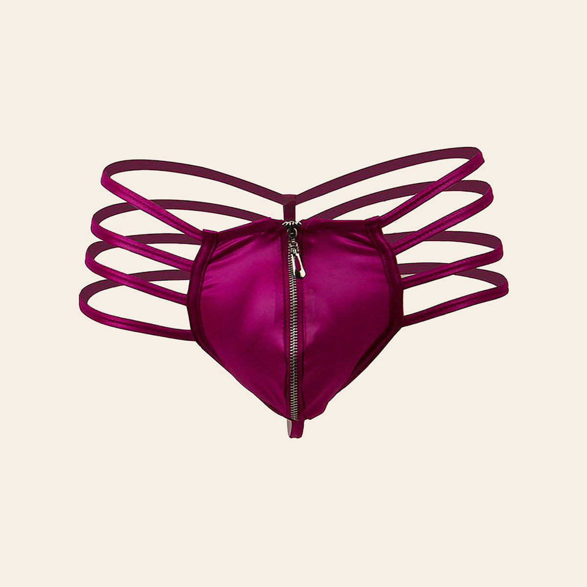 Men's zipper briefs in fuchsia with a front zipper and four-strap side detail, on a beige background