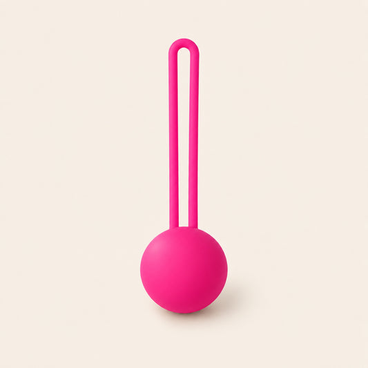 BloomCore rose-pink single spherical weight with an integrated retrieval loop on a beige background.